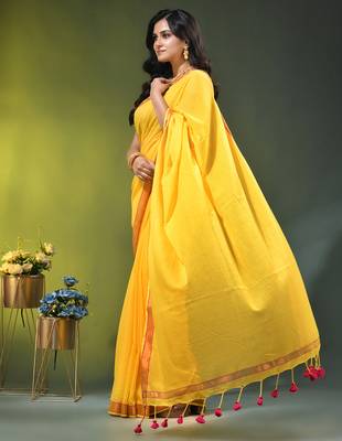 yellow solid mulmul cotton blend saree with contrast border 3