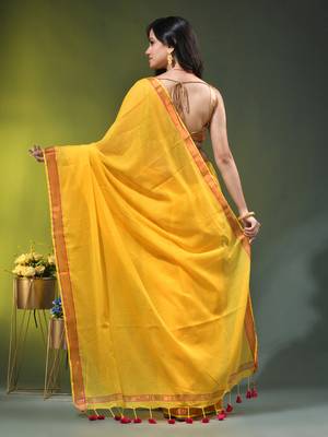 yellow solid mulmul cotton blend saree with contrast border 4