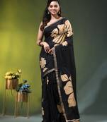 black mulmul cotton blend saree with golden hibiscus foil print