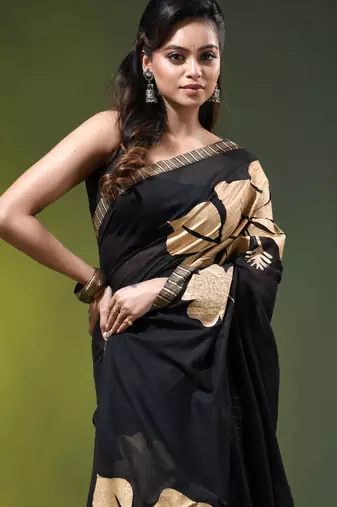 black mulmul cotton blend saree with golden hibiscus foil print