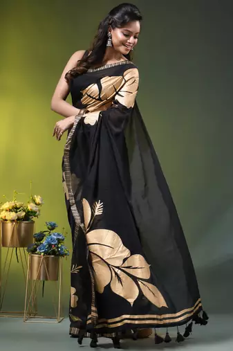 black mulmul cotton blend saree with golden hibiscus foil print