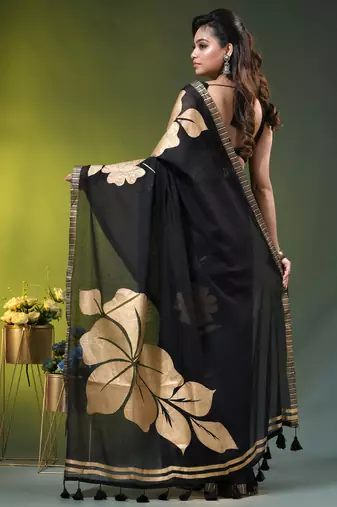 black mulmul cotton blend saree with golden hibiscus foil print
