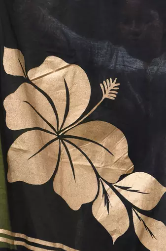 black mulmul cotton blend saree with golden hibiscus foil print