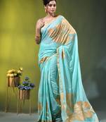 sea green mulmul cotton blend saree with golden hibiscus foil print