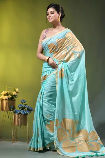 sea green mulmul cotton blend saree with golden hibiscus foil print