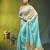 sea green mulmul cotton blend saree with golden hibiscus foil print