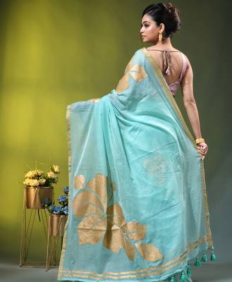 sea green mulmul cotton blend saree with golden hibiscus foil print 4