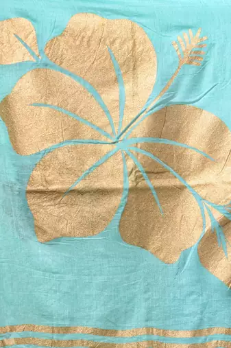 sea green mulmul cotton blend saree with golden hibiscus foil print