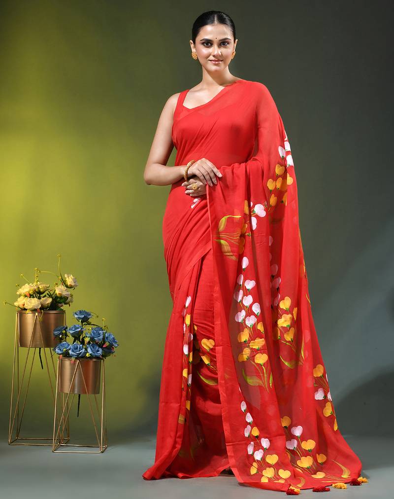 red mulmul saree with painted floral motifs