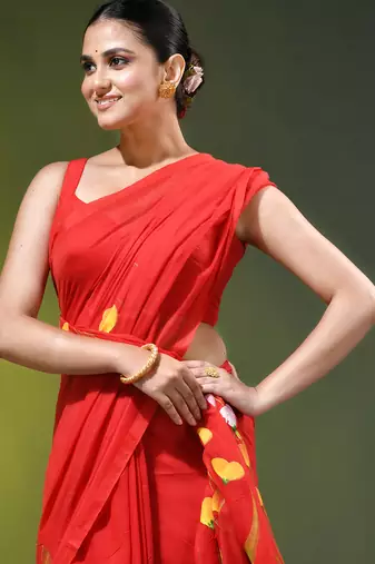 red mulmul saree with painted floral motifs