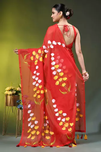 red mulmul saree with painted floral motifs