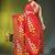 red mulmul saree with painted floral motifs