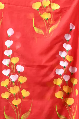 red mulmul saree with painted floral motifs