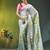 sage green mulmul saree with painted floral motifs