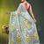 sage green mulmul saree with painted floral motifs