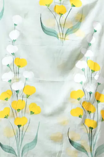 sage green mulmul saree with painted floral motifs