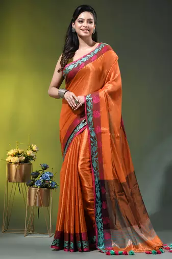 Orange tissue saree with rose woven border