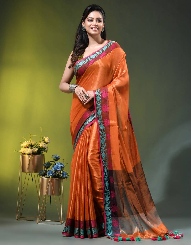 Orange tissue saree with rose woven border