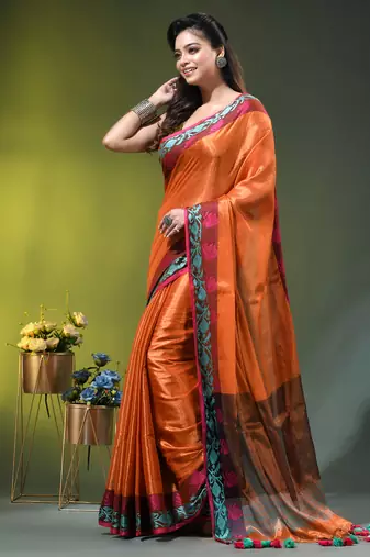 Orange tissue saree with rose woven border