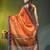 Orange tissue saree with rose woven border