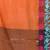 Orange tissue saree with rose woven border
