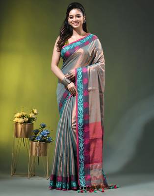 Sea green tissue saree with rose woven border 1