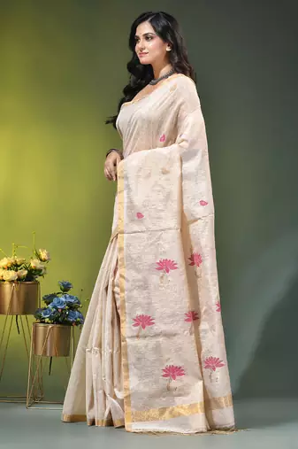 Off white tissue saree with lotus woven design