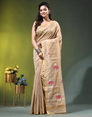 Beige tissue saree with lotus woven design 1
