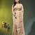 Beige tissue saree with lotus woven design