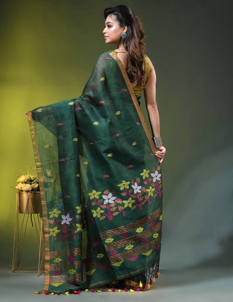Dark green linen saree with floral woven pallu