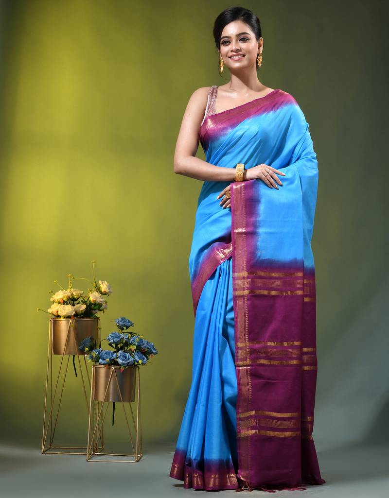sky blue & purple silk blend saree with zari border