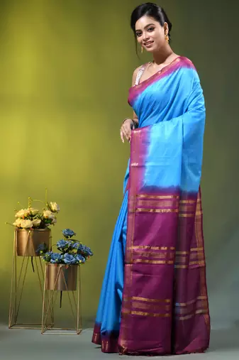 sky blue & purple silk blend saree with zari border