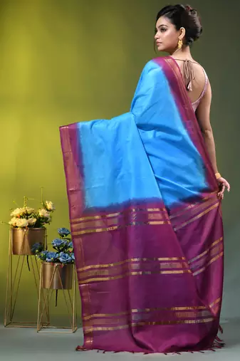 sky blue & purple silk blend saree with zari border