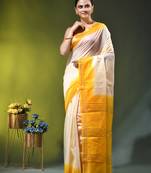off white & yellow silk blend saree with zari border