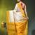 off white & yellow silk blend saree with zari border