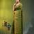olive green cotton blend saree with ethnic motifs