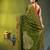 olive green cotton blend saree with ethnic motifs