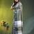 green cotton blend saree with bird motifs