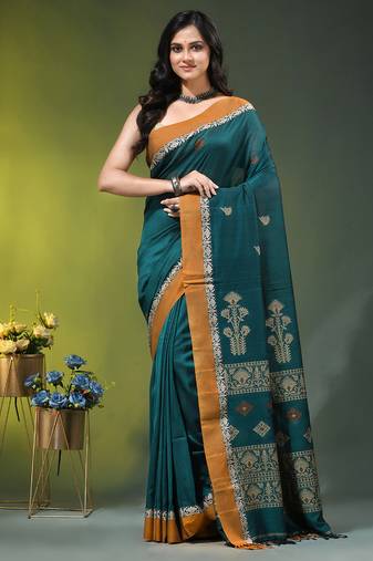teal cotton blend saree with ethnic motifs
