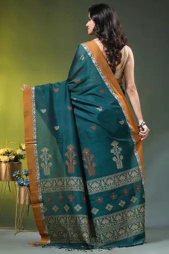 teal cotton blend saree with ethnic motifs