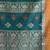 teal cotton blend saree with ethnic motifs