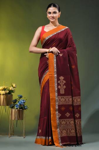 maroon cotton blend saree with ethnic motifs
