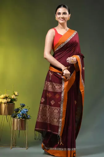 maroon cotton blend saree with ethnic motifs