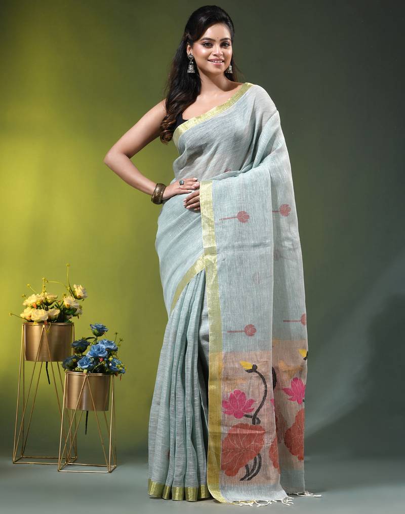 Sky blue linen saree with red floral woven design