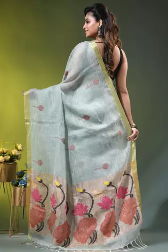 Sky blue linen saree with red floral woven design