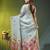 Sky blue linen saree with red floral woven design