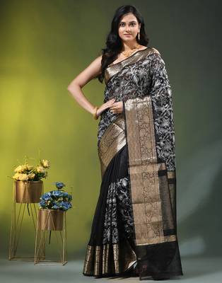 Elegant black organza saree with white floral embroidery & rich golden zari border 1