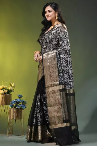 Elegant black organza saree with white floral embroidery & rich golden zari border