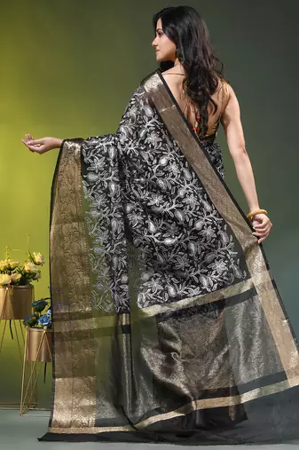 Elegant black organza saree with white floral embroidery & rich golden zari border