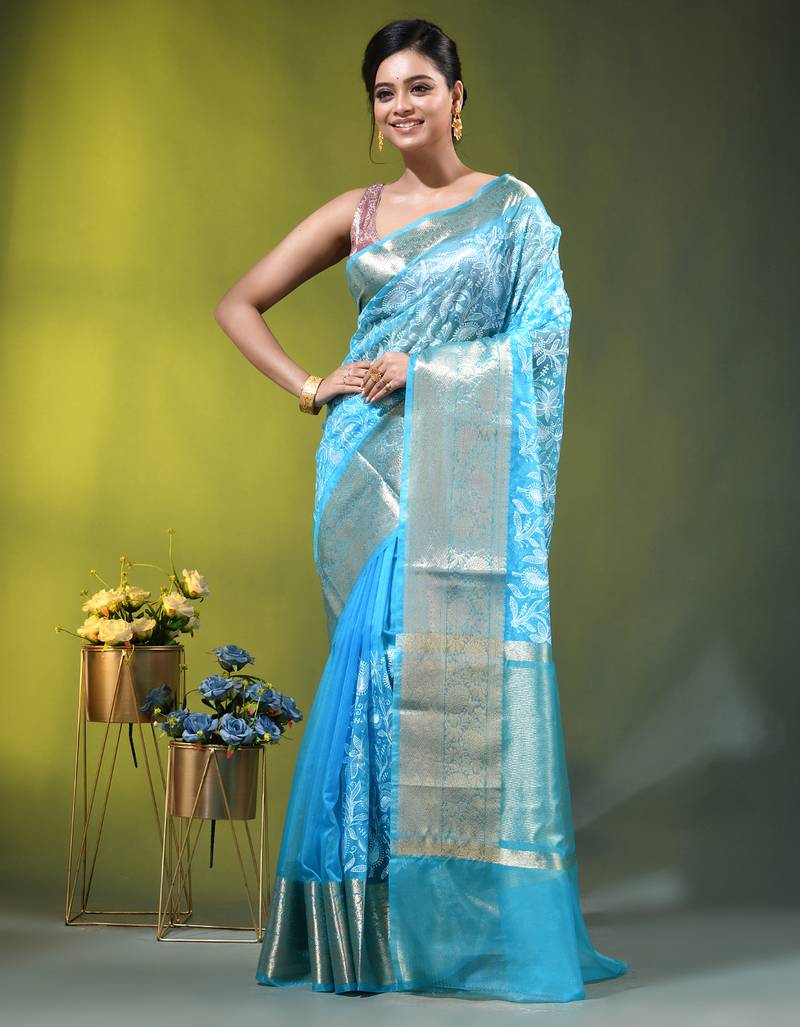 Elegant sky blue organza saree with white floral embroidery & rich golden zari border